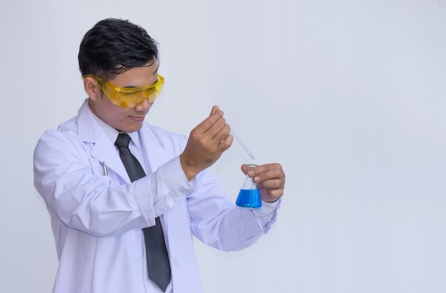 Young man scientist in chemistry lab