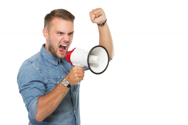 Young man scream with a megaphone