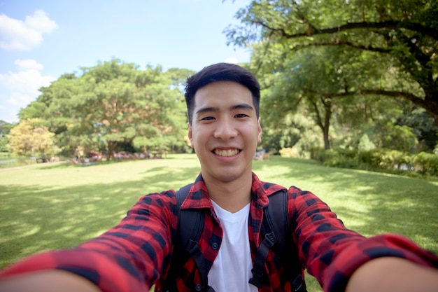 A young man  a selfie during a walk in nature