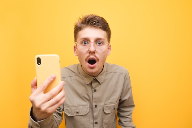 Photo young man in shirt and glasses isolated