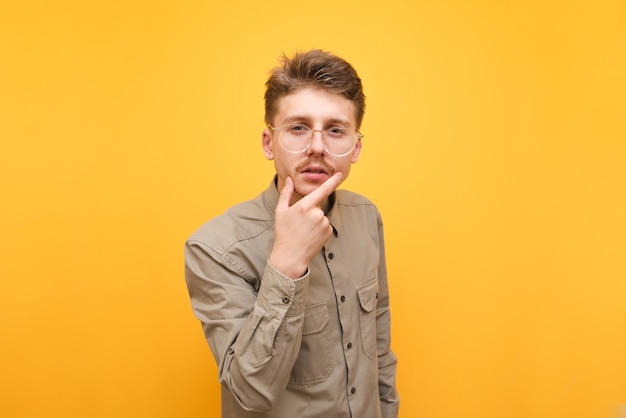 Young man in shirt and glasses isolated