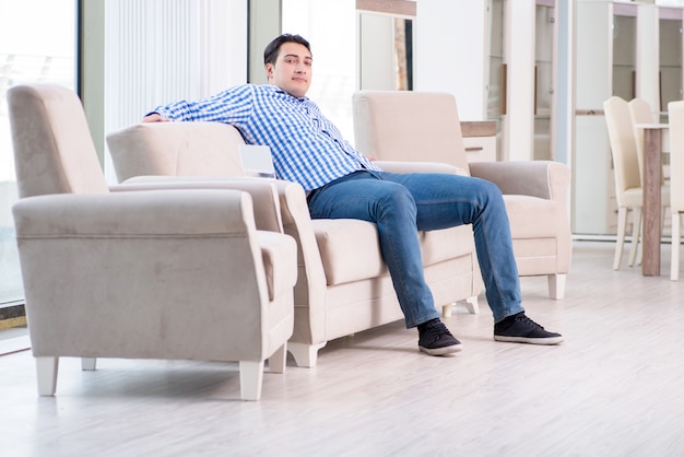 Young man shopping in furniture store