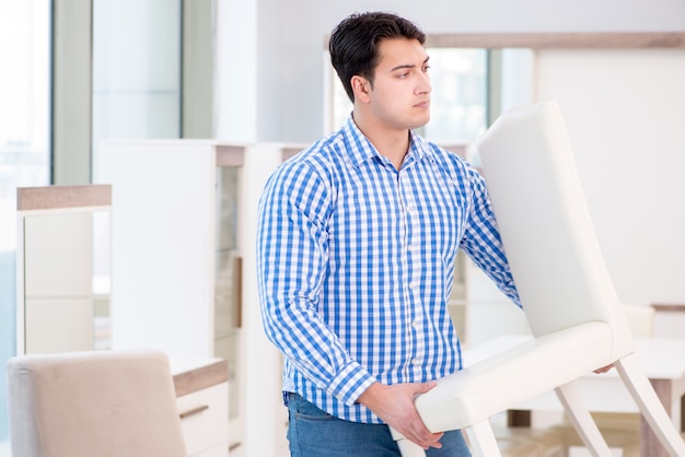 Young man shopping in furniture store