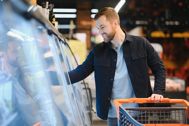 Young man shopping in grocery store Shopping concept