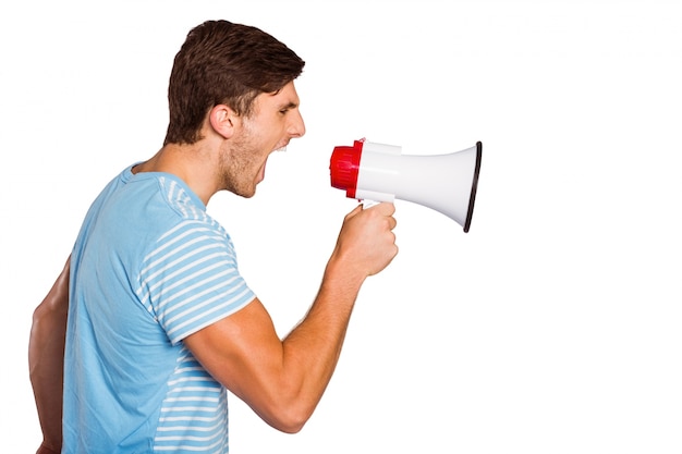 Young man shouting through megaphone