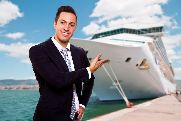 Young man show the Cruise Ship