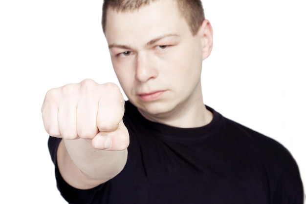 Photo young man show the fist on white background