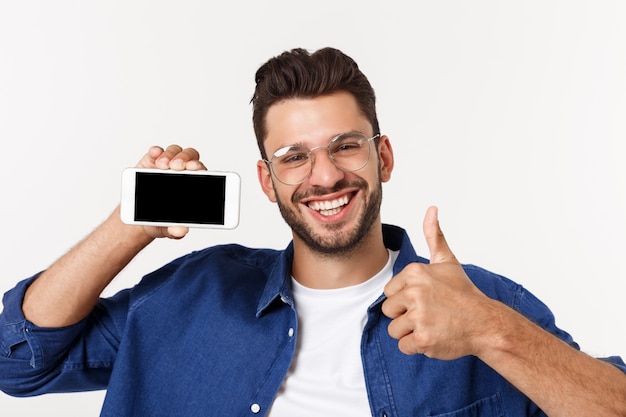 Young man showing his brand new smart phone isolated.