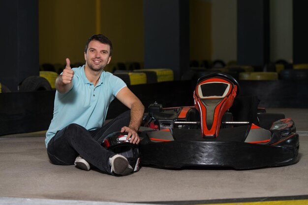 Young Man Showing Thumbs Up For Karting Race