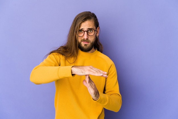 Young man showing a timeout gesture