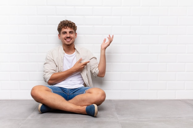 young man sitting on the floor