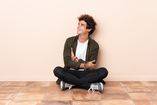 Young man sitting on the floor