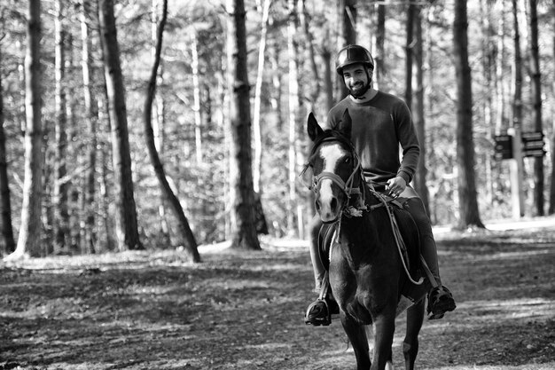 Young Man Sitting on a Horse Outdoors