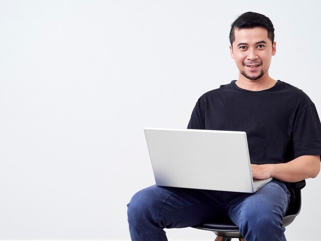 Young man sitting work with laptop