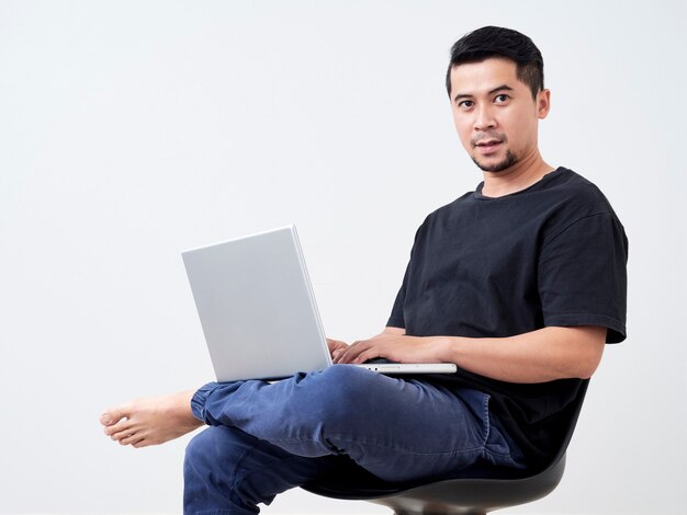 Young man sitting work with laptop