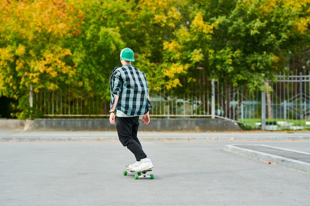 Young Man Skating Back View