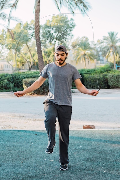 Young man skipping rope