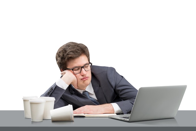 Young man sleeping at working place