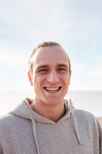 Young man smiling happy and looking at camera