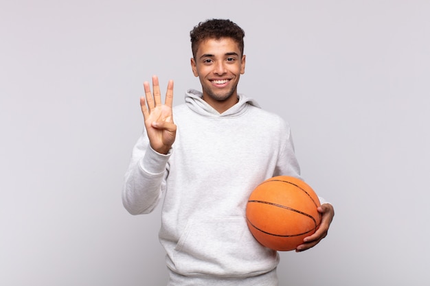 Young man smiling and looking friendly