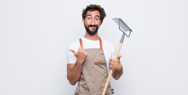 Young man smiling with both thumbs up