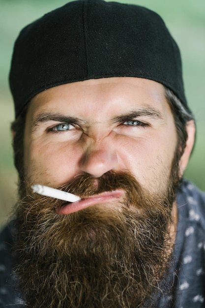 Young man smoking cigarette