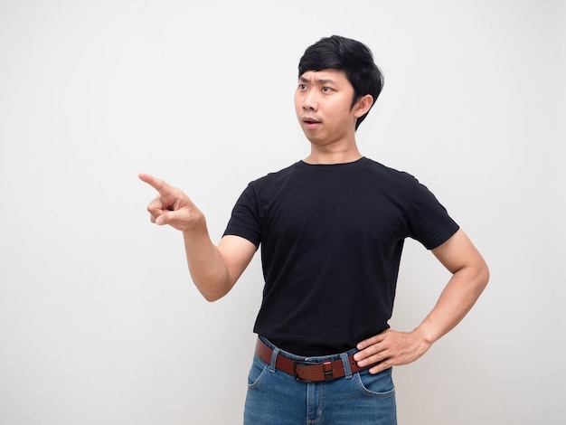 Young man stand gesture point finger command isolated