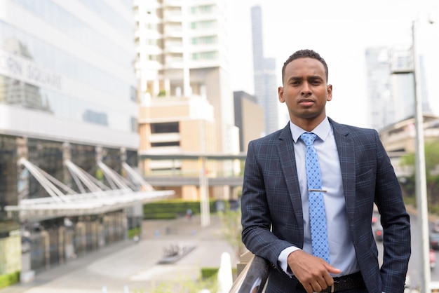 Young man standing in city