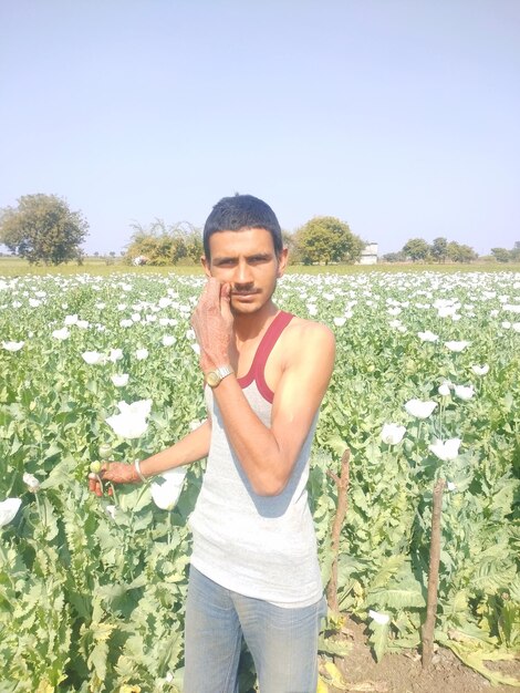 Young man standing on field