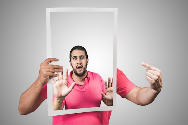 Young man stuck inside a poster