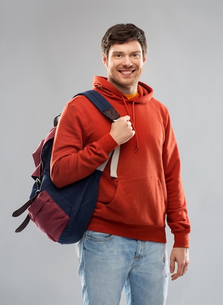 young man or student with school bag or backpack