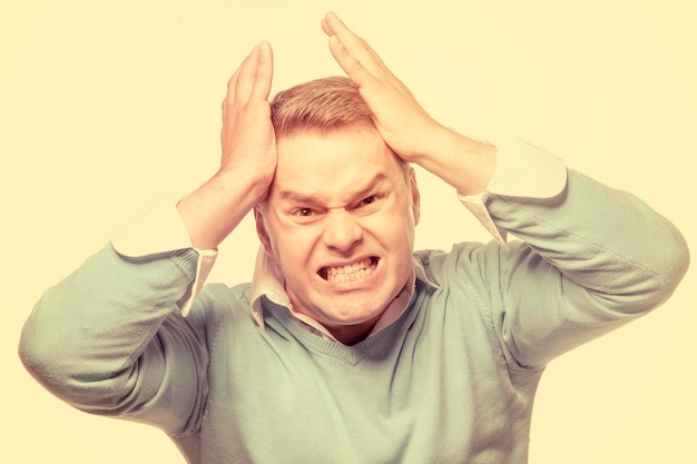 Young man suffering from headache and stress