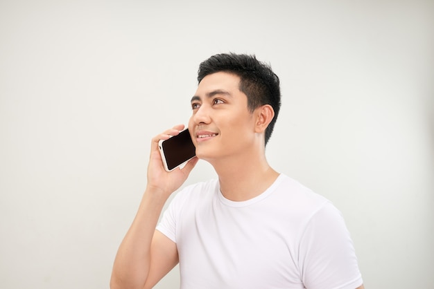 Young man talk to mobile phone