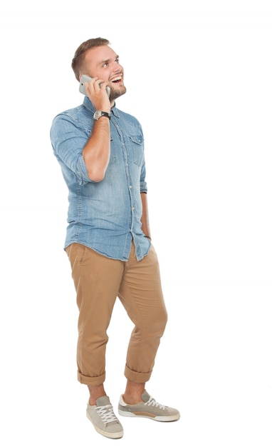 Young man talking on the phone, isolated