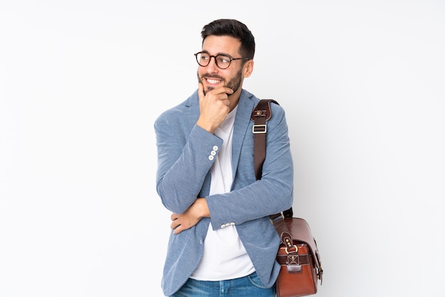 Young man thinking on white