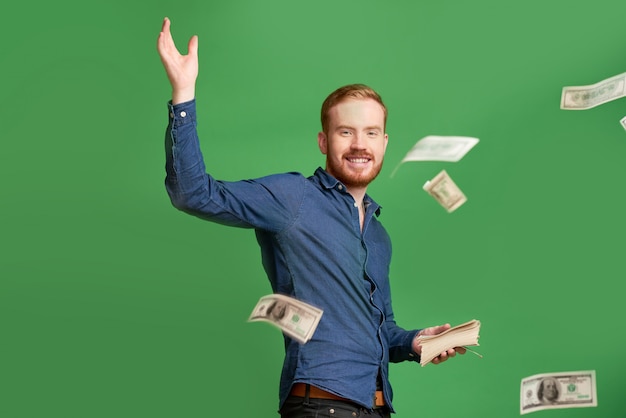 Young man throwing money