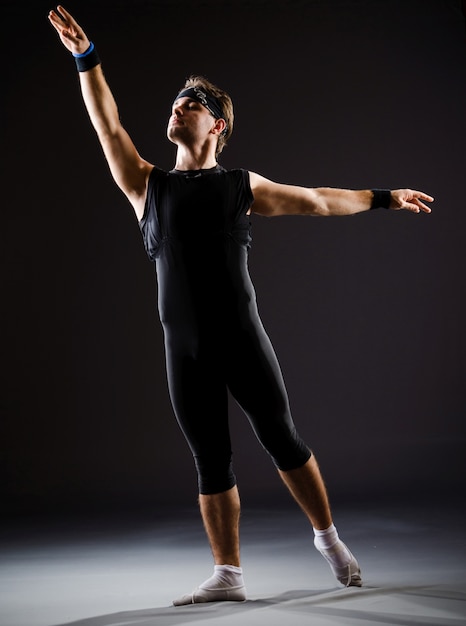 Young man training for ballet dances