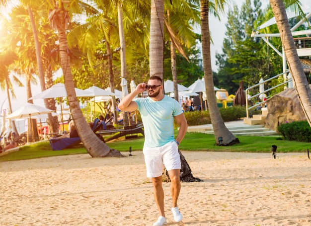 Young man on a tropical beach.