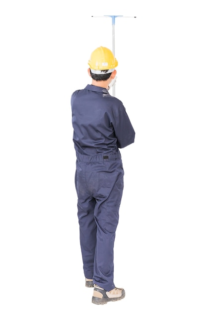 Photo young man in uniform hold mop for cleaning glass window, cut out isolated on white background