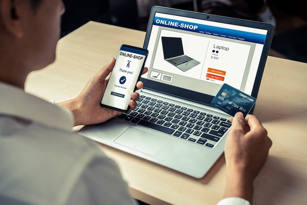 young man use credit card for online shopping