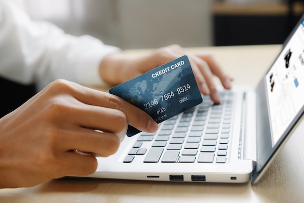 Young man use credit card for online shopping