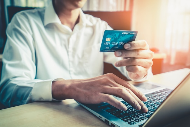 Young man use credit card for online shopping