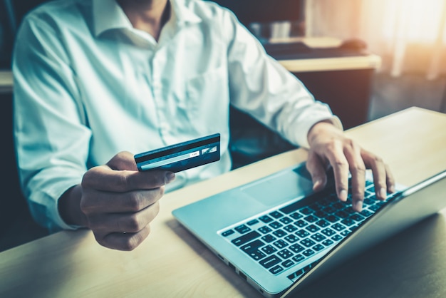 Young man use credit card for online shopping