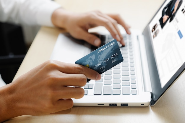 Young man use credit card for online shopping