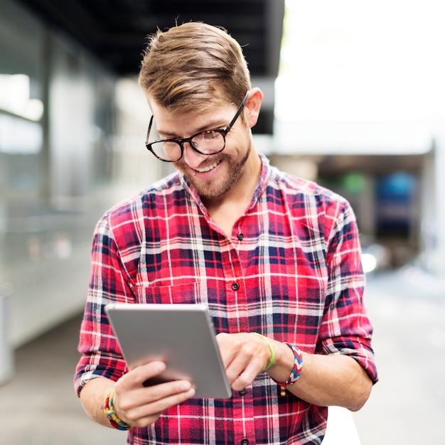 Young Man Using Browsing Tablet Concept