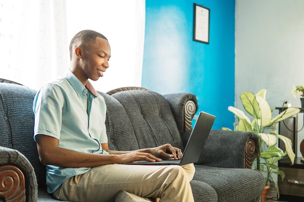 Young man using a computer at home