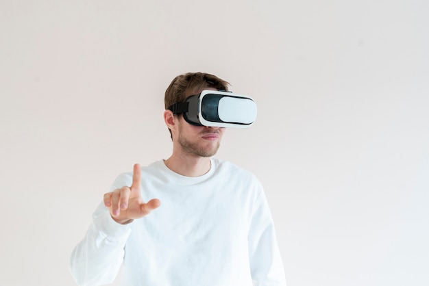 A young man using futuristic virtual reality glasses, vr technology