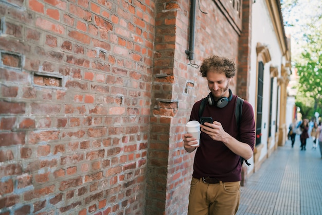 Young man using his mobile phone.