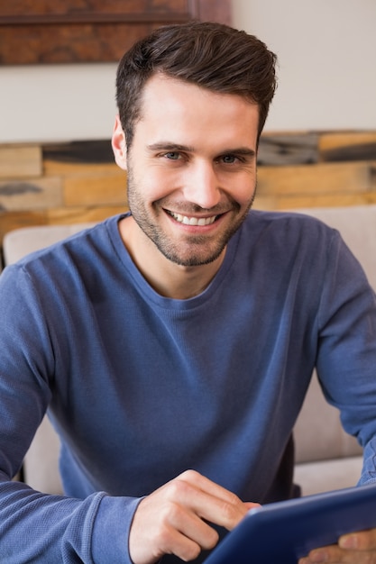 Young man using his tablet pc