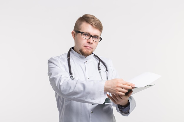 Young man using mobile phone against white background